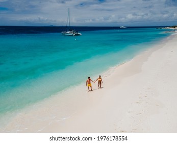 Small Curacao Island Famous For Day Trips And Snorkeling Tours On White Beaches Blue Clear Ocean, Curacao Island In The Caribbean Sea. A Couple Of Men And Woman On The Beach During A Vacation Holiday