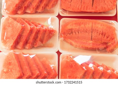 Small Cut Of Watermelon In Styrofoam Tray With Cling Film At Market Stand In Singapore. Summer Tropical Fruit In Plastic Wrap For Convenience To-go Take Away Healthy Snacks