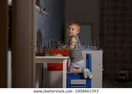 Similar – Baby girl playing with hair clips sitting in the floor