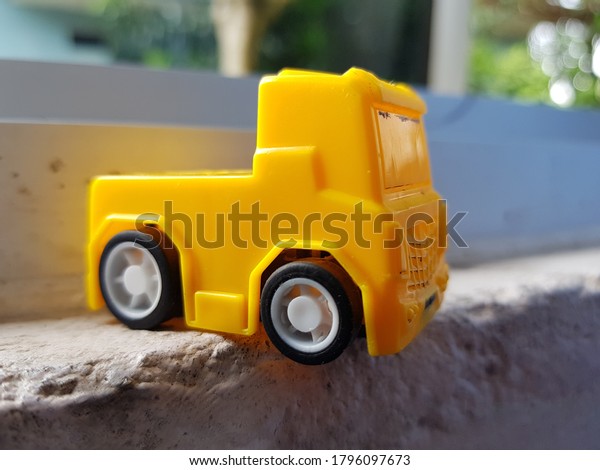 small cute yellow car\
toy