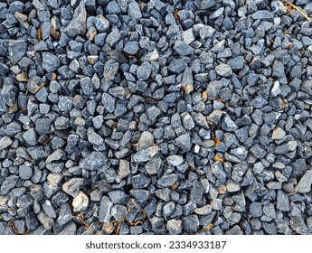 Small dark stones on rocky gravel pathway - Shutterstock ID 2334933187