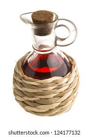 Small Decanter With Red Wine Vinegar Isolated On The White