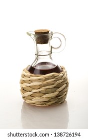 Small Decanter With Red Wine Vinegar Isolated On The White