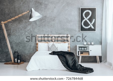 Image, Stock Photo Small black and white dog lies cuddled up in a blanket on the sofa and looks into the camera