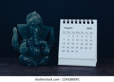 Small Desk Calendar With Elephant Statue Decor Closeup