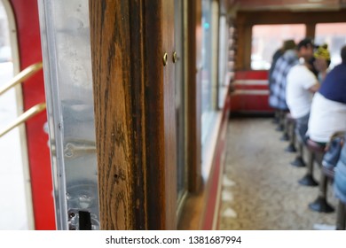 Small dining car and customers sitting at the counter.