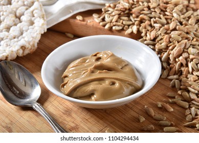 A Small Dish Of Fresh Sunflower Seed Butter With Rice Cakes