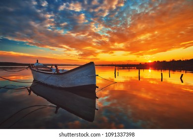 Small Dock And Boat At The Lake, Sunset Shot