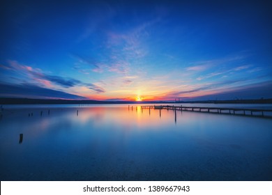 Small Dock And Boat At The Lake, Sunset Shot