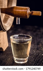 Small Dose Glasses, High Quality Distilled Alcohol. Brazilian Cachaça (called Pinga), Dripping, With Rustic Wood Brazil, Bar Image, Old Cellar.