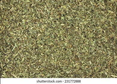 Small Dried Basil Leaves Abstract Background