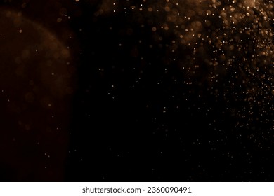 small drops of rain, snow on a black background. wind. Natural background. golden - Powered by Shutterstock