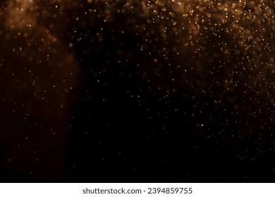 small drops of rain, snow on a black background. wind. Natural background. golden - Powered by Shutterstock