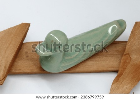 Small duck decoration on a piece of wood