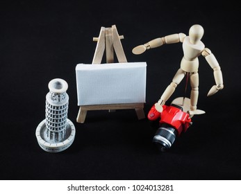 Small dummy red camera and art canvas on easel. Here you can write a message. - Powered by Shutterstock