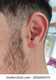 Small Ear Piercing Of A Young Boy