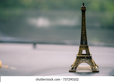 Small Eiffel tower toy background.
