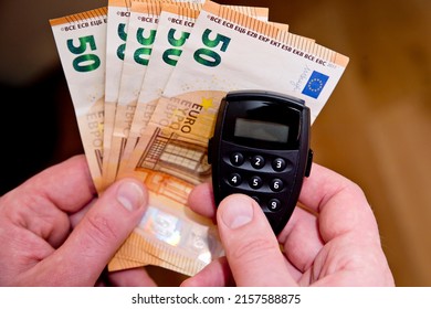 Small Electronic Password Generator Used For Banking Security On On Euro Banknotes. Saving Money Concept. Finance, Business, Investment. Spending Cash For Unexpected Expense.