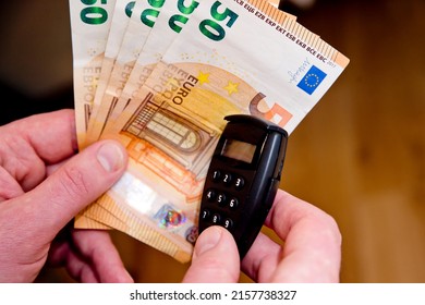 Small Electronic Password Generator Used For Banking Security On On Euro Banknotes. Saving Money Concept. Finance, Business, Investment. Spending Cash For Unexpected Expense.