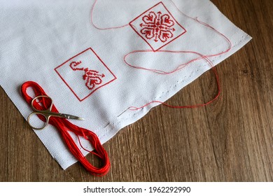 Small Embroidery Pattern Of Hearts On A White Canvas. The Ornament Is Made With Red Floss Threads. Cross Stitch Type