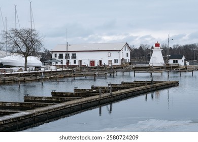 Small empty winter harbour with lighthouse in Ontario