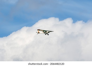 Small Engine Airplane Flying Among The Clouds