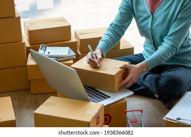 Small Entrepreneurs Start A Home Business By Arranging Goods With Brown Parcel Boxes, Small Home Business Startup Ideas.