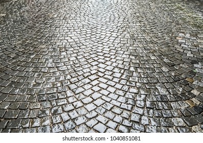 Small European Street  . Rainy Day, Wet Cobble Stones. Empty Road In City Center.Paving Stone Road 