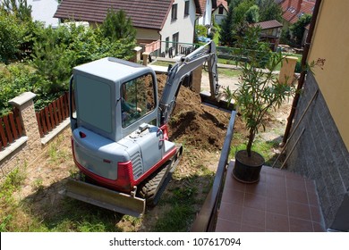 A Small Excavator Provides Garden At The House