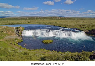 A small falls with a constructions for the passage of salmon to spawn - Iceland