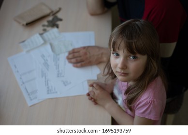 Small Family. Father Has Financial Problems From Coronavirus. His Little Daughter Calms Down Sad Father