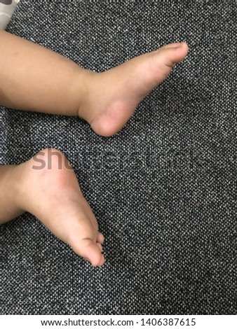 Small feet of children black background