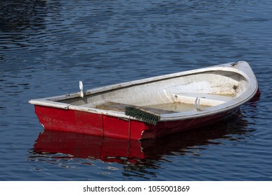 A Small Fiberglass Row Boat Slowly Sinking In Loch Lomond And Trossachs National Park Scotland 