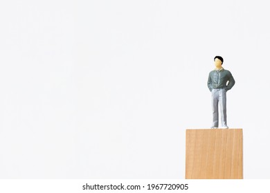 Small Figure Of Smart Man On White Background