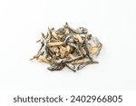 Small fish and almond snack on a white background.