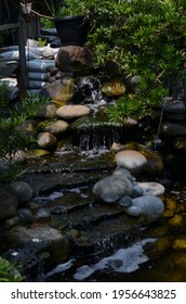 Small Fish Pond Fountain With Several Levels.