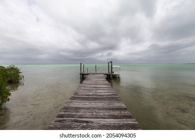 Small Fishing Boat Dock With Storm Clouds On The Gulf Of Mexico.