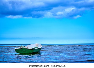 Small fishing boat with fishing net and equipment - Shutterstock ID 1968409105