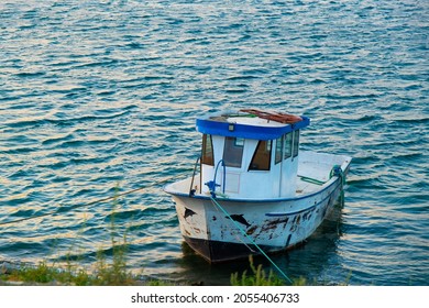 Small Fishing Boat, An Old Fishing Boat In The Rough Sea.