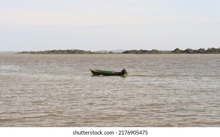 A Small Fishing Boat On Lake Guaíba In The City Of Porto Alegre, Brazil.