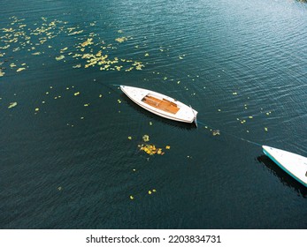 A Small Fishing Boat On A Middle Of Calm Lake. Top View.