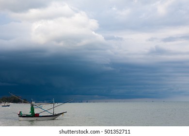 small fishing boat on the sea Storm is coming