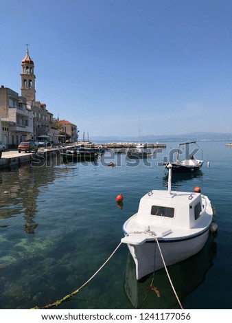 Similar – Image, Stock Photo Waterfront with small fishing boats in Spain Cadiz