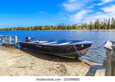 Small Fishing Boat Tethered To A Dock
