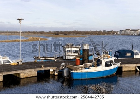 Similar – Image, Stock Photo Fishing boat moored in ocean water