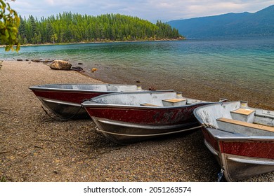 Small Fishing Boats On The Beach At Fish Creek, Glacier National Park, Montana, USA