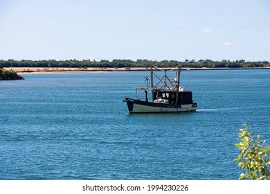 Small Fishing Trawler Anchored In The Pioneer River In Mackay.