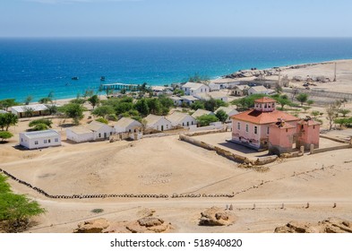 Small Fishing Village Mucuio With Dominating Portuguese Colonial Building In Angola