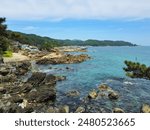 Small fishing village with seaside rocks