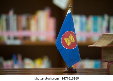 A Small Flag, The Symbol Of The ASEAN Logo On The Desk